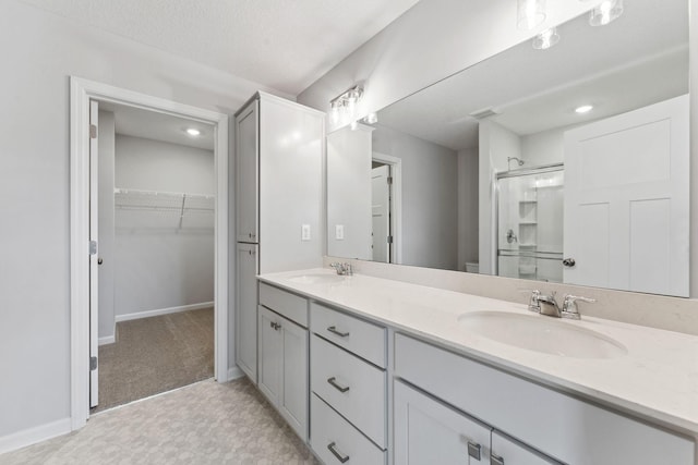 7407 E Ramsey Pkwy NW, Ramsey, MN 55303 - full bath with a stall shower, double vanity, and a walk in closet