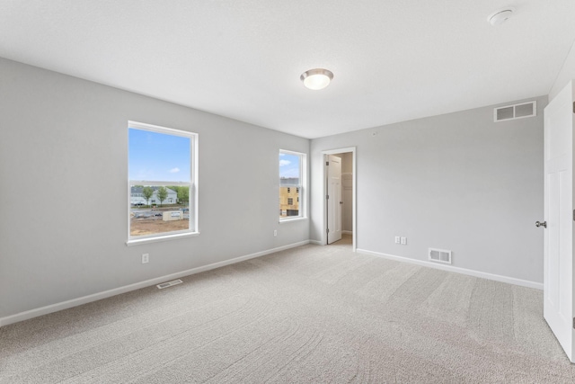 7407 E Ramsey Pkwy NW, Ramsey, MN 55303 - carpeted empty room with baseboards and a smoke detector