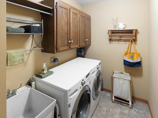 461 Dudley Ave, Shoreview, MN 55126 - laundry room featuring cabinet space, washing machine and dryer, and stone finish floors