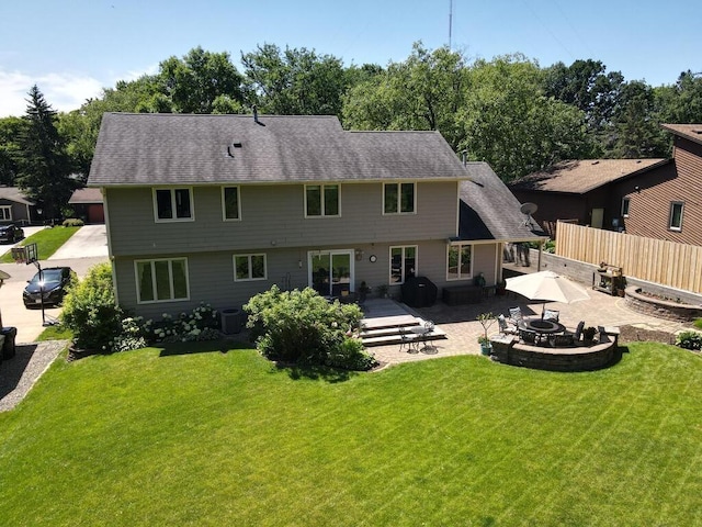 461 Dudley Ave, Shoreview, MN 55126 - back of property featuring a patio, an outdoor fire pit, and a deck