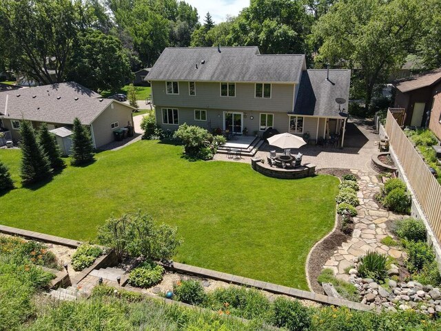 461 Dudley Ave, Shoreview, MN 55126 - rear view of house featuring a fenced backyard, a wooden deck, and a patio area