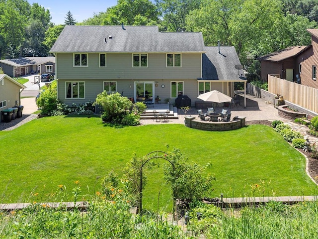 461 Dudley Ave, Shoreview, MN 55126 - rear view of house with a patio, a fenced backyard, and roof with shingles