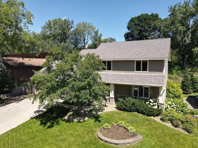 461 Dudley Ave, Shoreview, MN 55126 - view of front facade with a shingled roof, a front yard, and concrete driveway