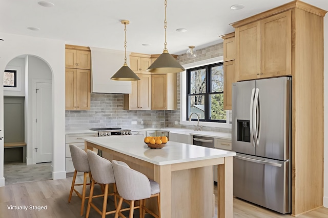 987 Island Lake Ave, Shoreview, MN 55126 - kitchen featuring stainless steel appliances, light brown cabinets, light wood-style flooring, light countertops, and recessed lighting