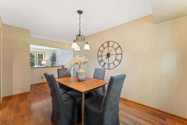 1111 Edgewater Ave, Arden Hills, MN 55112 - dining room with wood finished floors and a chandelier