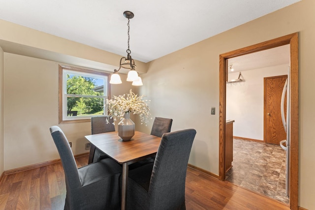 1111 Edgewater Ave, Arden Hills, MN 55112 - dining area featuring a chandelier and wood finished floors