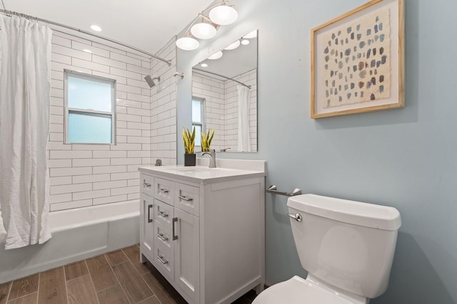 1111 Edgewater Ave, Arden Hills, MN 55112 - bathroom featuring vanity, shower / tub combo with curtain, wood finish floors, and recessed lighting