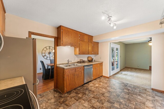 1111 Edgewater Ave, Arden Hills, MN 55112 - kitchen featuring dishwasher, brown cabinets, light countertops, electric range, and stone finish floors