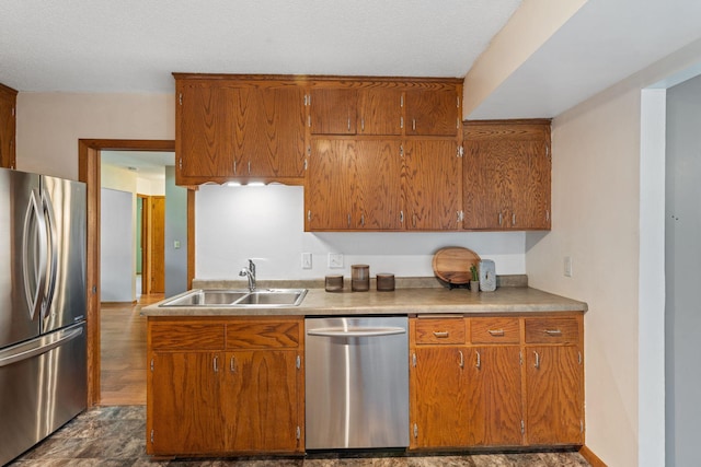 1111 Edgewater Ave, Arden Hills, MN 55112 - kitchen with appliances with stainless steel finishes, brown cabinets, and light countertops
