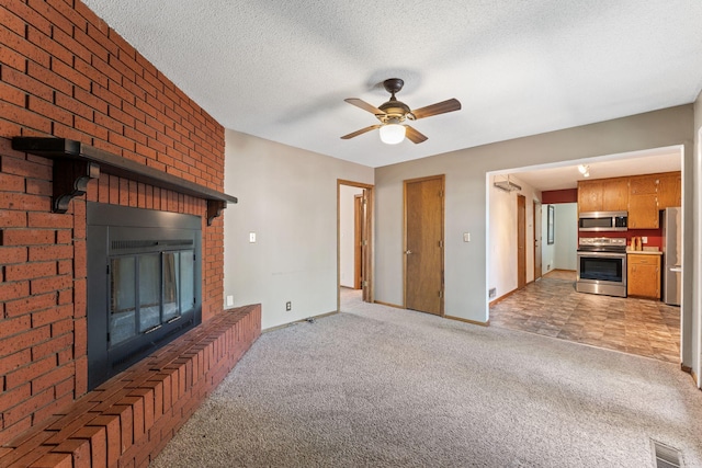 1111 Edgewater Ave, Arden Hills, MN 55112 - unfurnished living room featuring light colored carpet, a brick fireplace, ceiling fan, and a textured ceiling