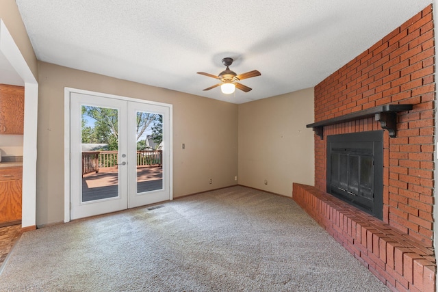 1111 Edgewater Ave, Arden Hills, MN 55112 - unfurnished living room with carpet flooring, ceiling fan, a brick fireplace, a textured ceiling, and french doors