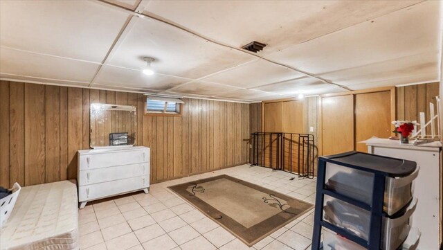 114 Fairview Ave NW, Long Prairie, MN 56347 - interior space featuring wooden walls and light tile patterned floors