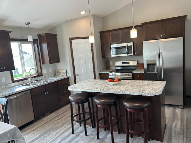 3454 237th Ave NW, Saint Francis, MN 55070 - kitchen featuring stainless steel appliances, dark brown cabinets, light wood-style floors, and recessed lighting