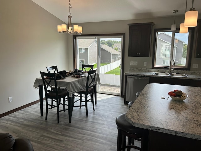 3454 237th Ave NW, Saint Francis, MN 55070 - dining space with wood finished floors, lofted ceiling, and a chandelier
