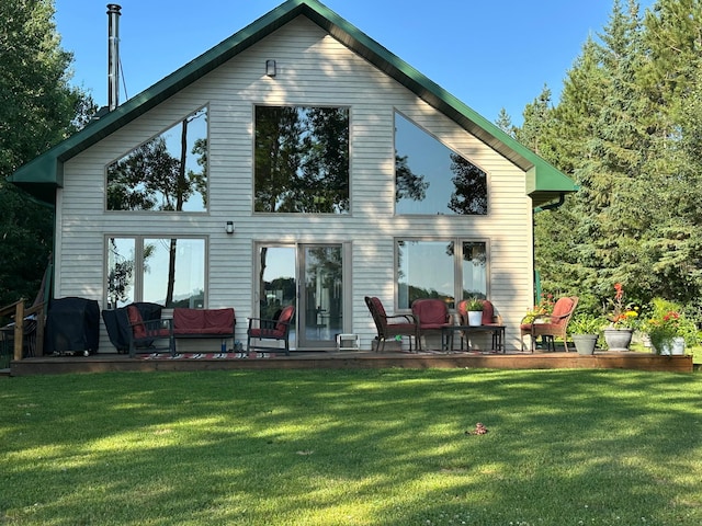 1415 Riverside Dr NW Unit 1415, Baudette, MN 56623 - back of house featuring a lawn