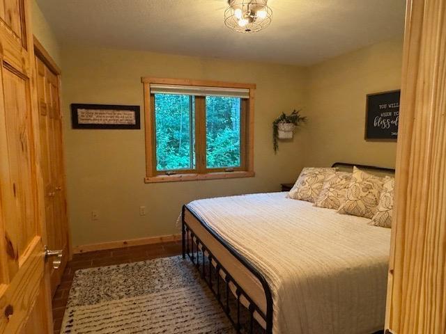 1415 Riverside Dr NW Unit 1415, Baudette, MN 56623 - bedroom featuring baseboards