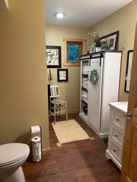 1415 Riverside Dr NW Unit 1415, Baudette, MN 56623 - bathroom with wood finished floors and toilet