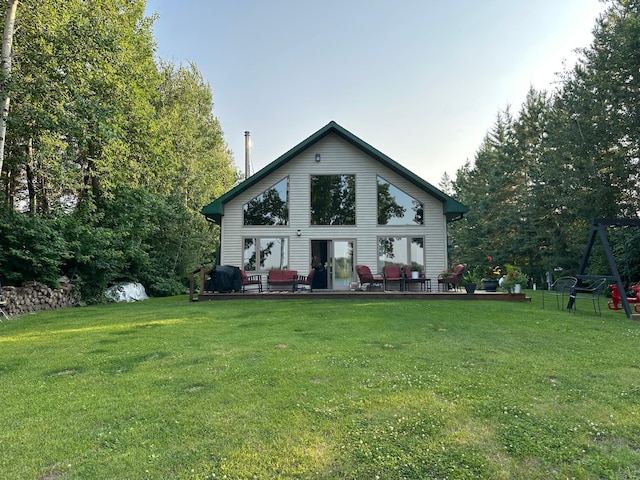 1415 Riverside Dr NW Unit 1415, Baudette, MN 56623 - rear view of property featuring a yard and a deck