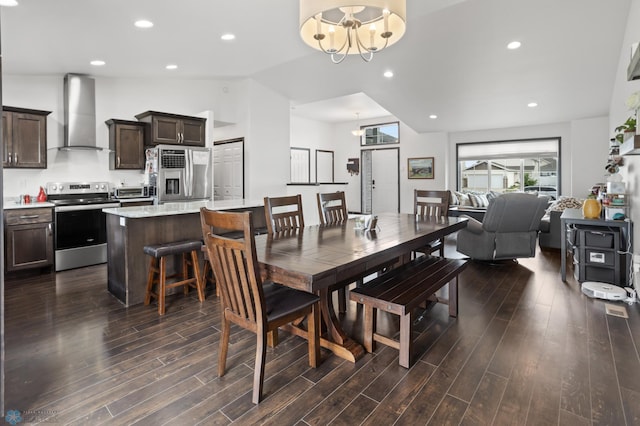 6028 59th Ave S, Fargo, ND 58104 - dining space featuring a chandelier, dark wood-style floors, vaulted ceiling, and recessed lighting