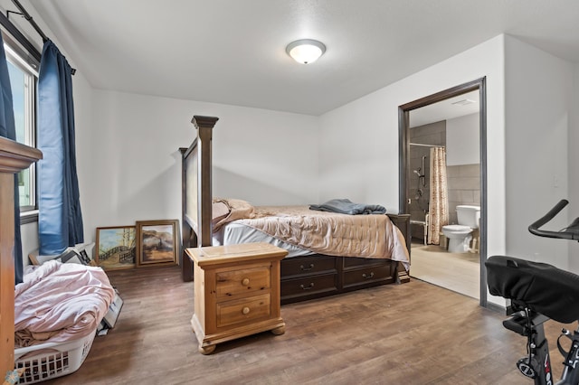 6028 59th Ave S, Fargo, ND 58104 - bedroom with wood finished floors and ensuite bathroom