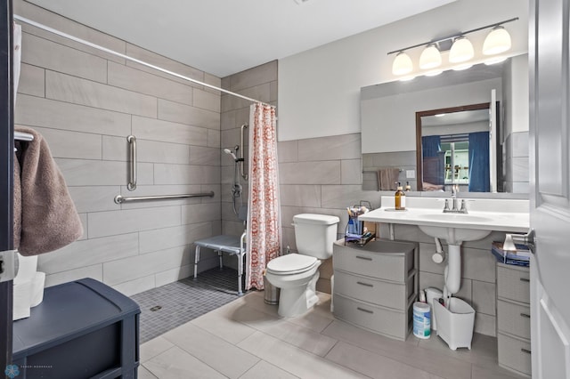 6028 59th Ave S, Fargo, ND 58104 - full bath with tile walls, a stall shower, and tile patterned flooring