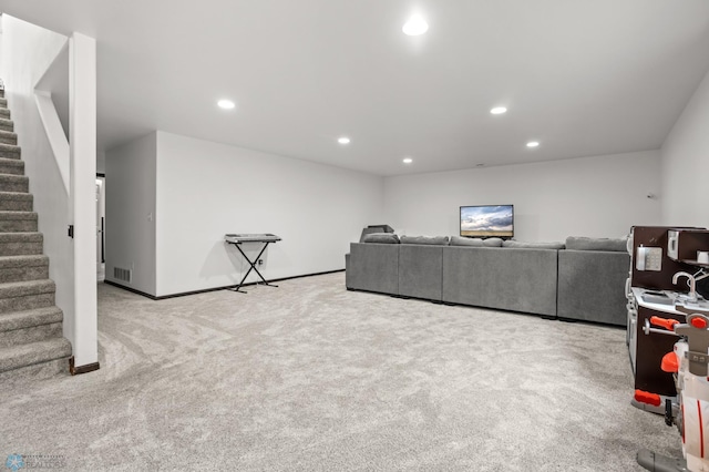 6028 59th Ave S, Fargo, ND 58104 - living room featuring stairway, light colored carpet, and recessed lighting