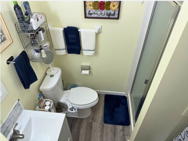 120 Demont Ave E Unit 208, Little Canada, MN 55117 - bathroom with wood finished floors, a stall shower, and vanity