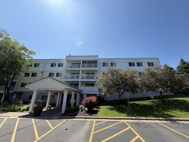 120 Demont Ave E Unit 208, Little Canada, MN 55117 - view of property featuring uncovered parking