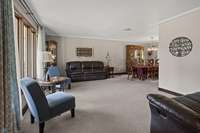 21 35th Ave NE, Fargo, ND 58102 - carpeted living area featuring a chandelier, a textured ceiling, and crown molding