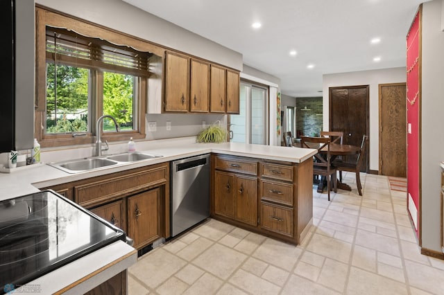 21 35th Ave NE, Fargo, ND 58102 - kitchen with stainless steel dishwasher, black electric range, a peninsula, light countertops, and recessed lighting