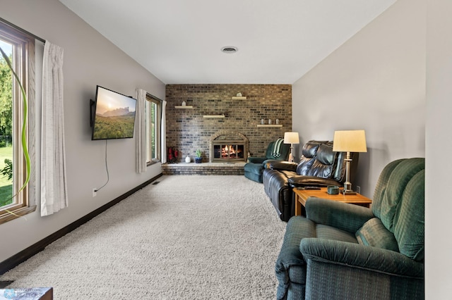 21 35th Ave NE, Fargo, ND 58102 - carpeted living area featuring plenty of natural light and a brick fireplace
