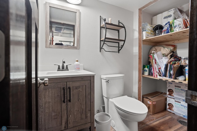 21 35th Ave NE, Fargo, ND 58102 - half bathroom with vanity and wood finished floors