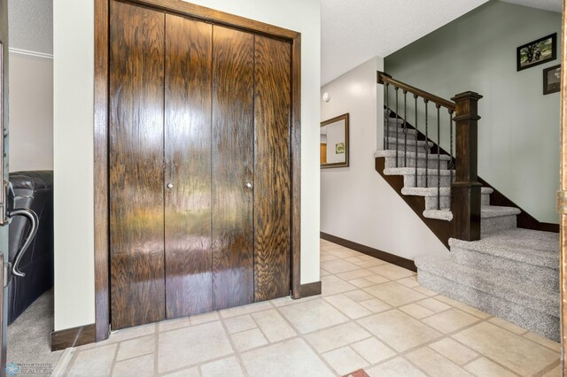 21 35th Ave NE, Fargo, ND 58102 - foyer entrance featuring stairway and baseboards