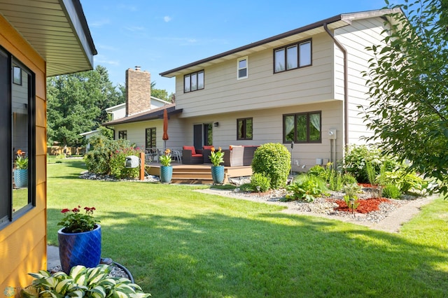 21 35th Ave NE, Fargo, ND 58102 - back of property featuring a chimney, a deck, and a yard
