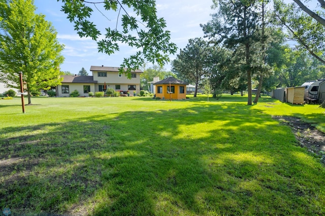 21 35th Ave NE, Fargo, ND 58102 - view of green lawn with an outdoor structure
