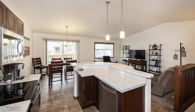 34 Cedar Dr, Mapleton, ND 58059 - kitchen featuring stainless steel appliances, light countertops, plenty of natural light, dark brown cabinetry, and lofted ceiling