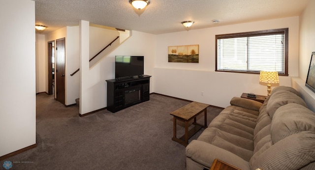 34 Cedar Dr, Mapleton, ND 58059 - living room with dark colored carpet, stairway, and a textured ceiling