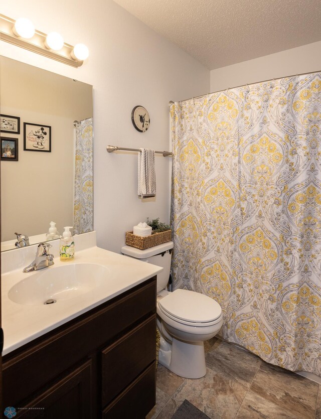 34 Cedar Dr, Mapleton, ND 58059 - bathroom with vanity and a textured ceiling