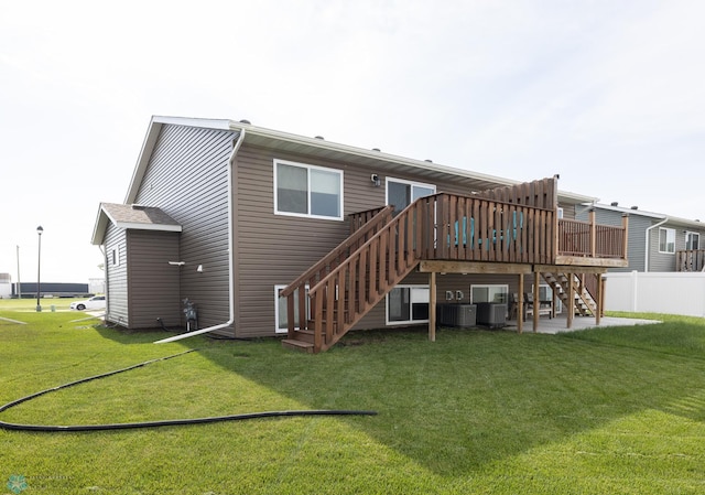 34 Cedar Dr, Mapleton, ND 58059 - back of property with stairway, a wooden deck, and a patio area