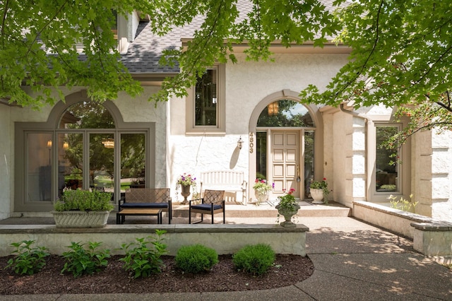 4803 Chantrey Pl, Minnetonka, MN 55345 - back of house with stucco siding, roof with shingles, and covered porch