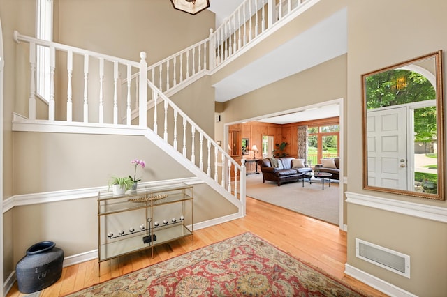 4803 Chantrey Pl, Minnetonka, MN 55345 - entryway featuring wood finished floors, stairs, and a towering ceiling
