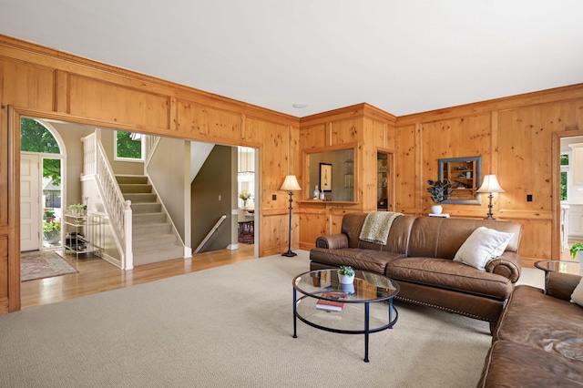 4803 Chantrey Pl, Minnetonka, MN 55345 - living area with wooden walls, stairway, carpet, crown molding, and wood finished floors