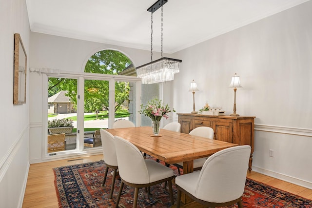 4803 Chantrey Pl, Minnetonka, MN 55345 - dining space featuring a chandelier, light wood-type flooring, and crown molding