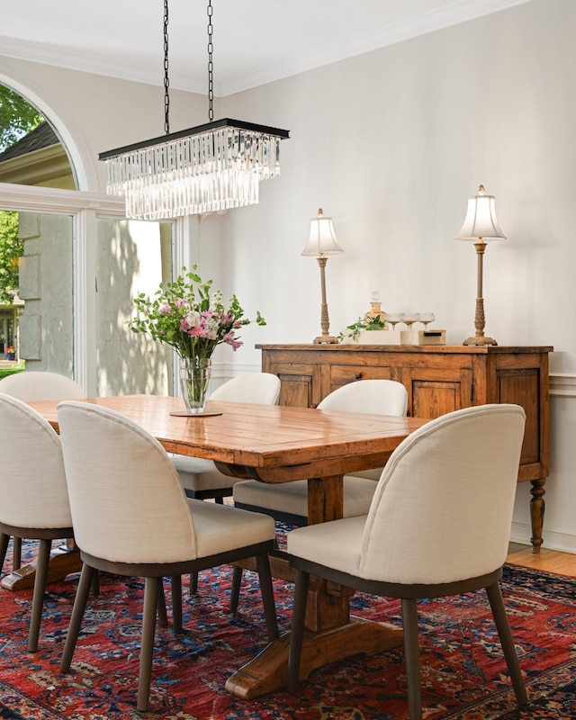 4803 Chantrey Pl, Minnetonka, MN 55345 - dining space featuring a chandelier, wood finished floors, and crown molding