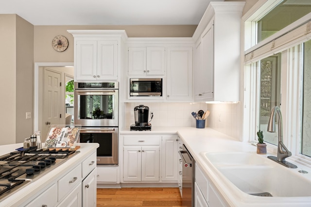 4803 Chantrey Pl, Minnetonka, MN 55345 - kitchen featuring stainless steel appliances, healthy amount of natural light, and white cabinets