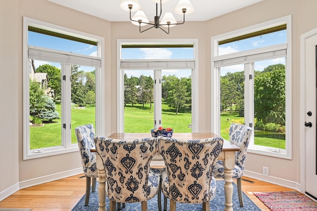 4803 Chantrey Pl, Minnetonka, MN 55345 - dining area with a chandelier and light wood-style floors