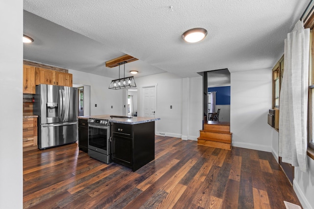 3322 277th Ave NW, Stanford Twp, MN 55040 - kitchen featuring stainless steel appliances, dark cabinets, dark wood-style flooring, a textured ceiling, and a kitchen island