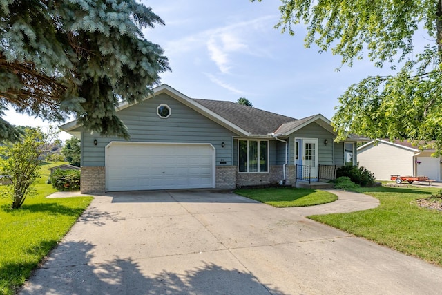 120 6th St SW, Chatfield, MN 55923 - single story home with brick siding, an attached garage, a front yard, and concrete driveway