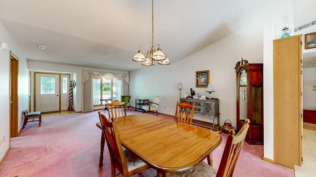 120 6th St SW, Chatfield, MN 55923 - dining space featuring light colored carpet, a chandelier, and vaulted ceiling
