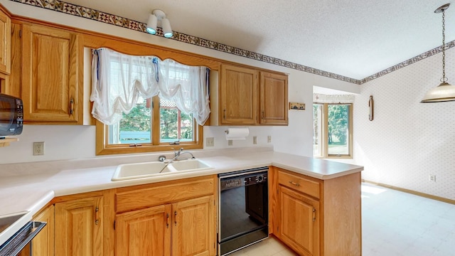120 6th St SW, Chatfield, MN 55923 - kitchen featuring black appliances, a peninsula, wallpapered walls, light floors, and light countertops